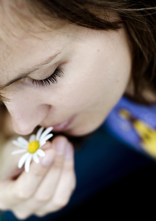 Close-up portrait of beautiful woman relaxing in natureの写真素材