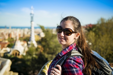 Pretty young female tourist posing in Parc Guell in Barcelona, Spain の写真素材