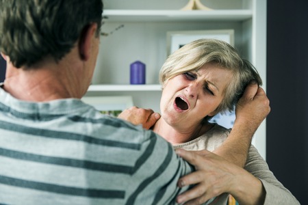 Portrait of woman victim of domestic violence  Man abusing senior woman with black eye-の写真素材