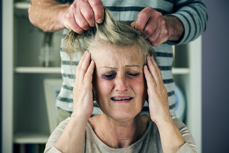 Portrait of woman victim of domestic violence  Man abusing senior woman with black eye-の写真素材