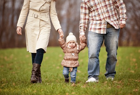Happy and young family relaxing together in autum natureの写真素材