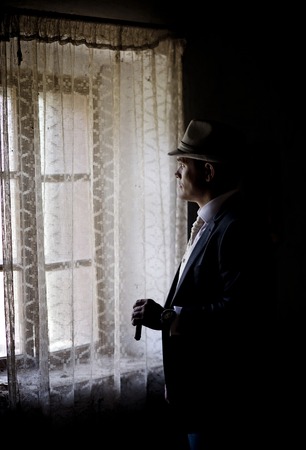 Portrait of handsome groom in hat with the cuban cigaretteの写真素材