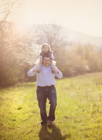 Young father during morning walk with his little daughterの写真素材