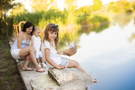 Family spending time at lakeの写真素材