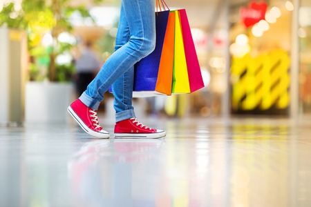 Shopping time, young teenage girl with shopping bags at shopping mallの写真素材