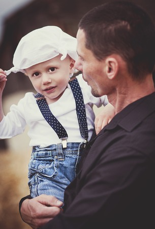 Little boy playing in nature with dadの写真素材