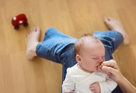 Newborn baby boy is tired and sleepyの写真素材
