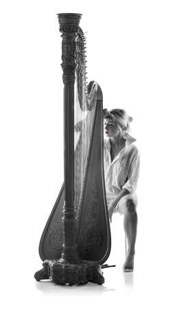 Harp player  woman on black and whiteの写真素材
