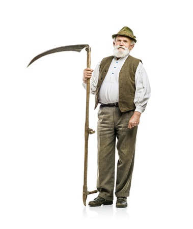 Old bearded bavarian man in hat holding scythe in his hand, isolated on white backgroundの写真素材