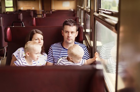Family with two children travel in retro train.の写真素材