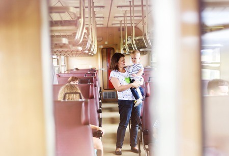 Mother with son travel in retro train.の写真素材