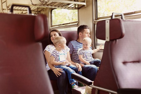 Family with two children travel in retro train.の写真素材