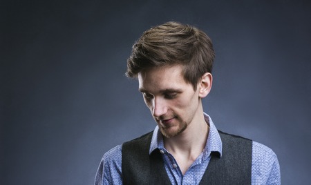 Stylish handsome young man posing. Studio shot on white backgroundの写真素材
