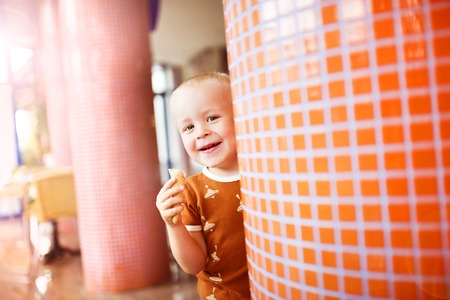 Little boy enjoying ice cream in cafeの写真素材