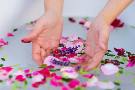 Beautiful young woman taking a herbal bath.の写真素材