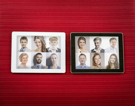 Tablet with isolated screen on red carpetの写真素材