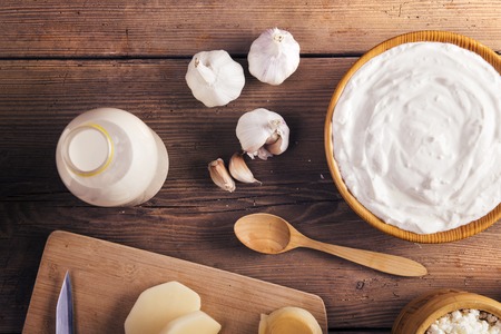 Variety of dairy products laid on a wooden table backgroundの写真素材