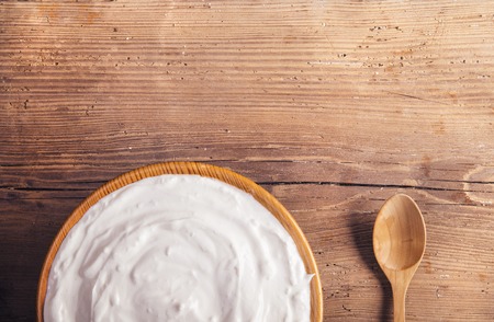 Variety of dairy products laid on a wooden table backgroundの写真素材
