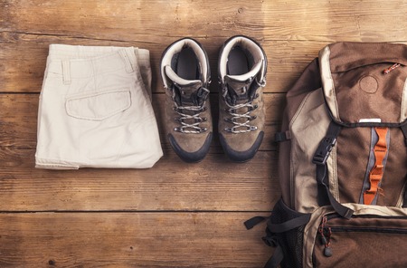 Equipment for hiking on a wooden floor backgroundの写真素材