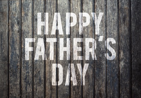 Happy fathers day sign on wooden boards background.の写真素材
