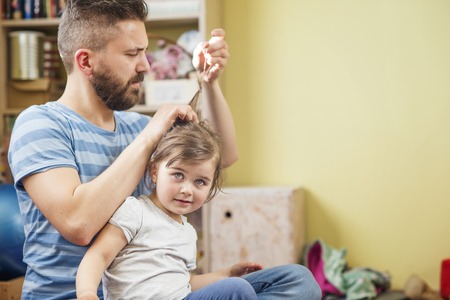 Young father with his cute little daughterの写真素材