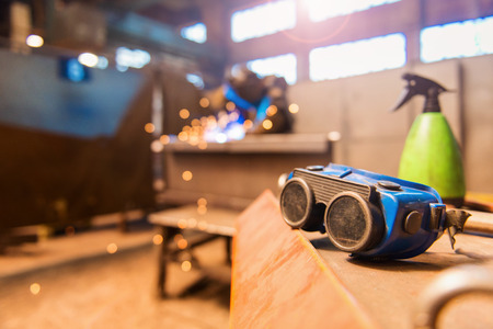 Close up of blue protective eyewear for weldingの写真素材