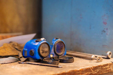 Close up of blue protective eyewear for weldingの写真素材