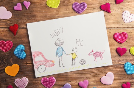 Fathers day composition - textile hearts on the floor. Studio shot on wooden background.の写真素材