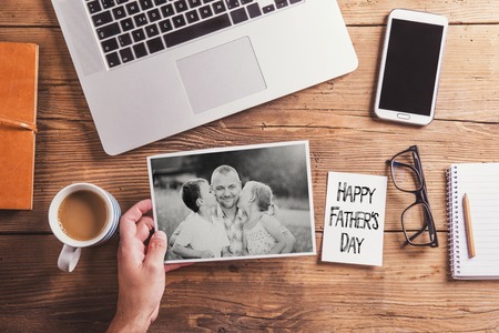 Fathers day composition - office desk. Studio shot on wooden background.