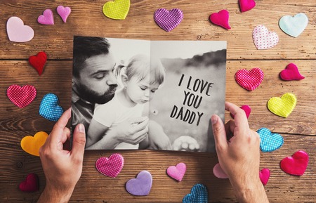 Fathers day composition - textile hearts on the floor. Studio shot on wooden background.の写真素材