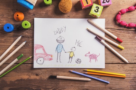 Fathers day composition - toys on floor. Studio shot on wooden background.の写真素材