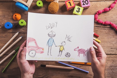 Fathers day composition - toys on floor. Studio shot on wooden background.の写真素材