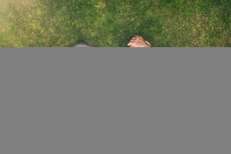 Beautiful seniors lying on a grass in a parkの写真素材