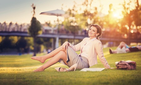 Attractive young business woman having a lunch breakの写真素材