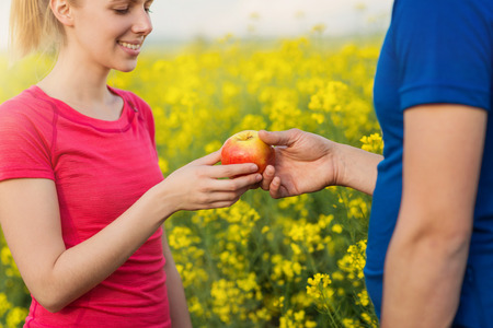 Couple in love sharing apple