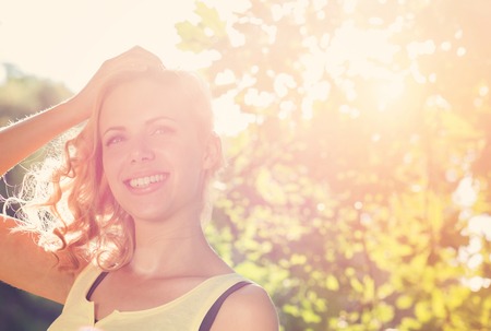 Attractive young woman outside in summer natureの写真素材
