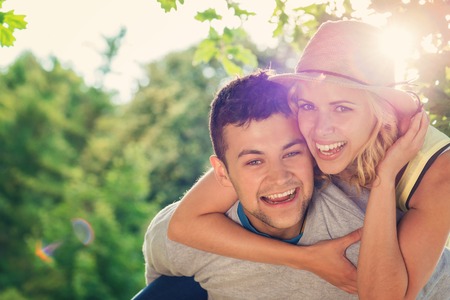 Beautiful young couple having fun outside on a summer dayの写真素材