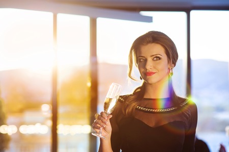 Attractive young woman with a drink on a terrace of a barの写真素材