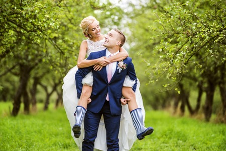 Beautiful young wedding couple outside in natureの写真素材
