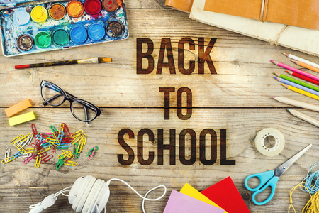 Back to school composition.  Studio shot on wooden background.
