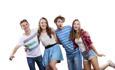 Trendy teenagers posing. Studio shot on white backgroundの写真素材