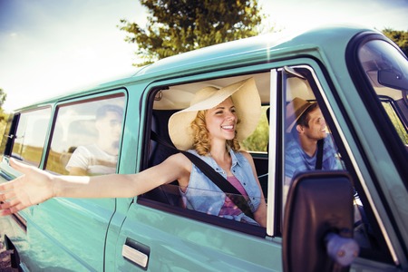 Teenage friends on a road trip on a summers dayの写真素材