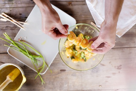 Preparation of king prawns in domestic kitchen.の写真素材