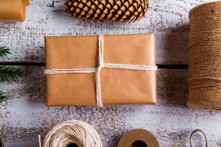 Christmas presents laid on a wooden table backgroundの写真素材