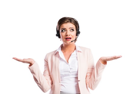 Attractive young business woman. Studio shot on white background.の写真素材