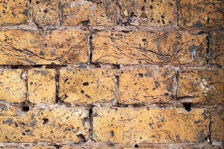 Fragment of an old brick wall background.の写真素材