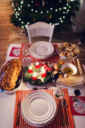 Christmas meal laid on a table in a decorated living roomの写真素材
