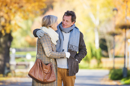 Beautiful  active seniors on a walk in a town parkの写真素材