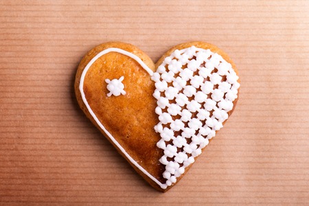 Gingerbread heart. Studio shot on paper background.の写真素材