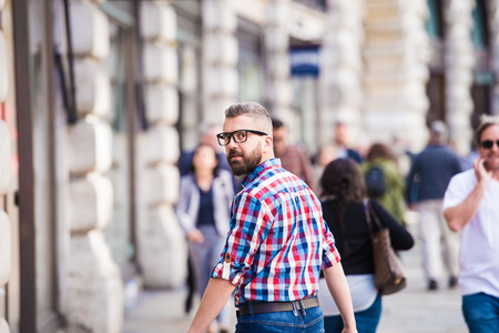 Young handsome man shopping in the streets of Londonの写真素材